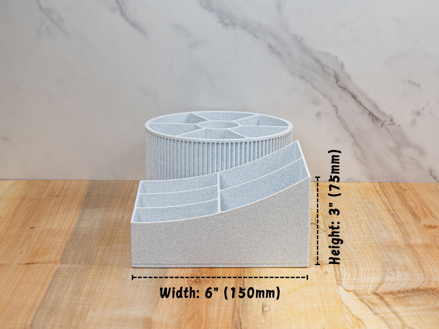 Side measurement graphic showing the rotating beauty organizer’s footprint: width labeled 6 in (150 mm) and overall height 3 in (75 mm), with the round carousel behind the stepped rectangular base for depth reference.