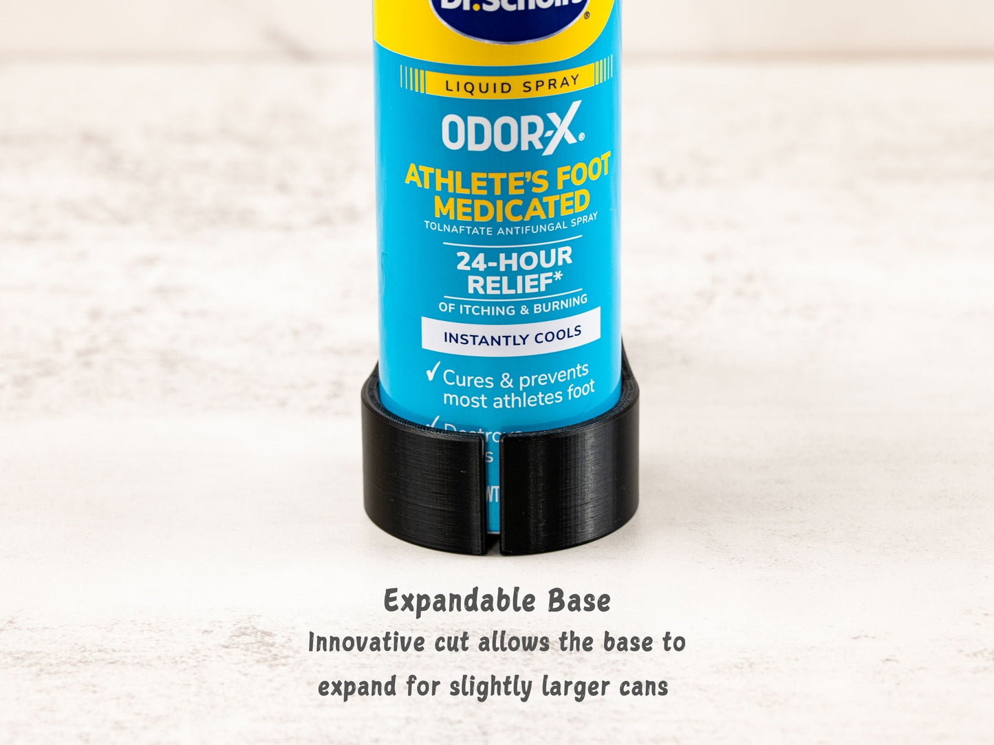 Zoomed-in view of expandable base on Dr. Scholl’s can, showing how the base flexes to accommodate slightly larger foot spray cans.
