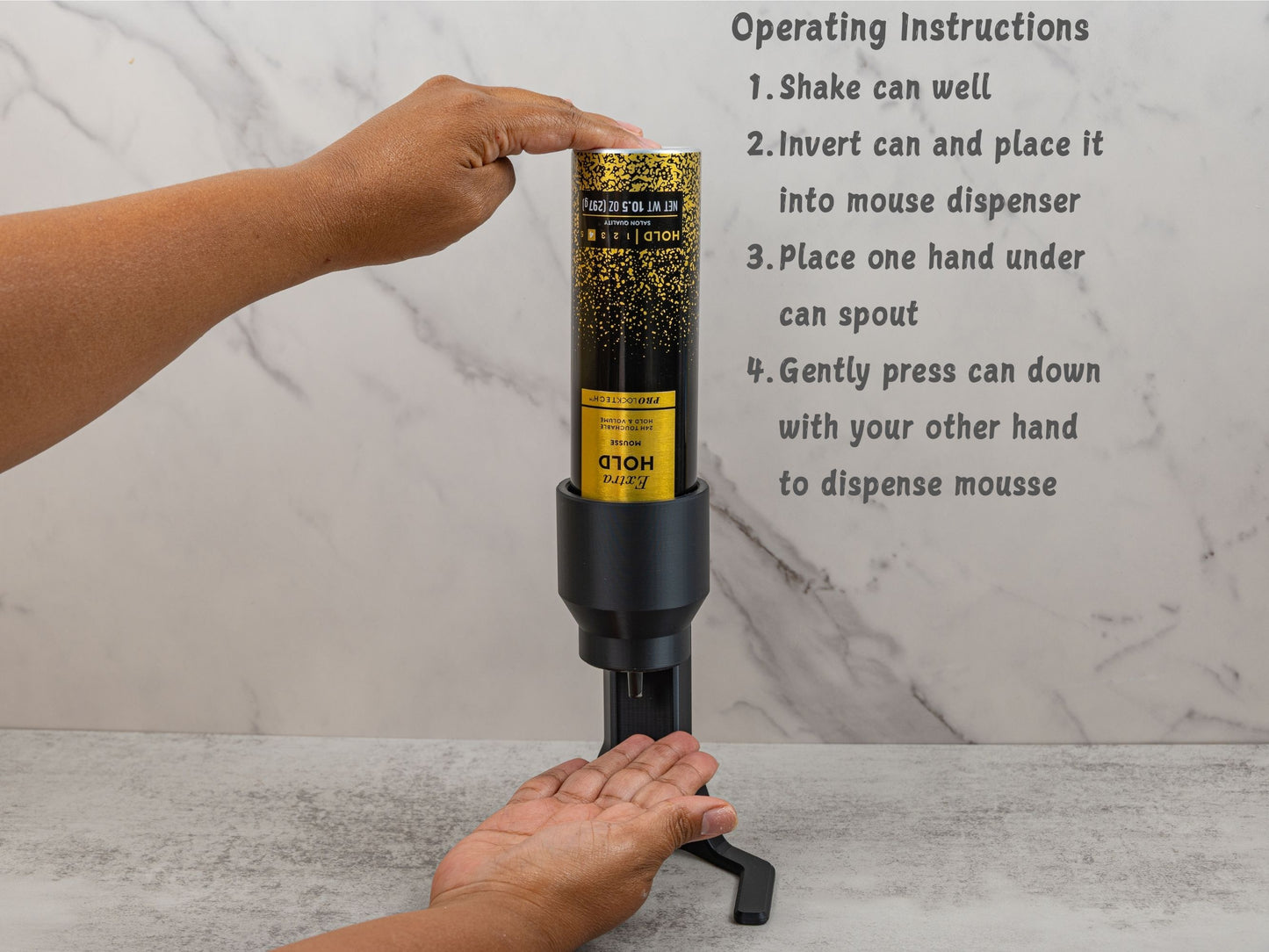 Demonstration of how to use the mousse dispenser with one hand under the nozzle and the other pressing down the can to release mousse.