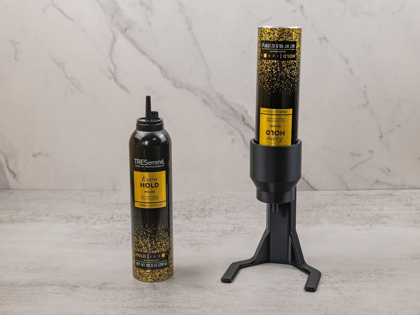 Visual comparison of a TRESemmé mousse can next to the mousse can mounted in the black PLA plastic dispenser for accessibility.