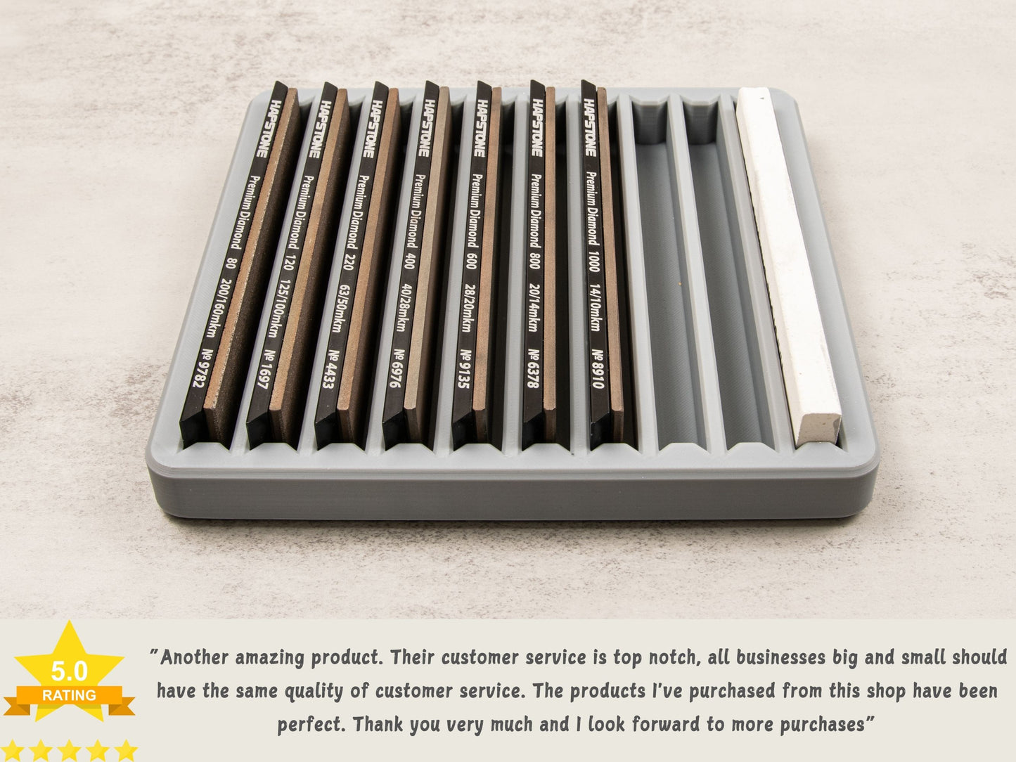 Sharpening stone tray holding various diamond stones and a strop, with a five-star customer review praising quality and service.
