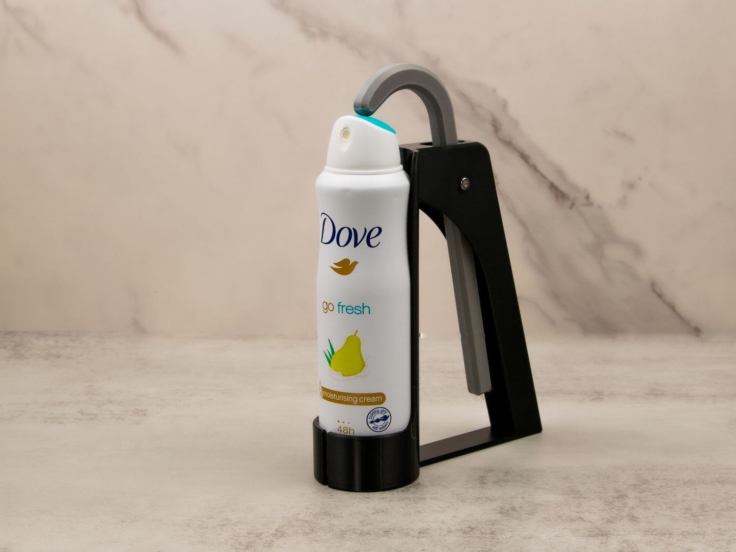 Clean, isolated product shot showing the assistant in use with a Dove spray can, angled to showcase the overall fit and design.