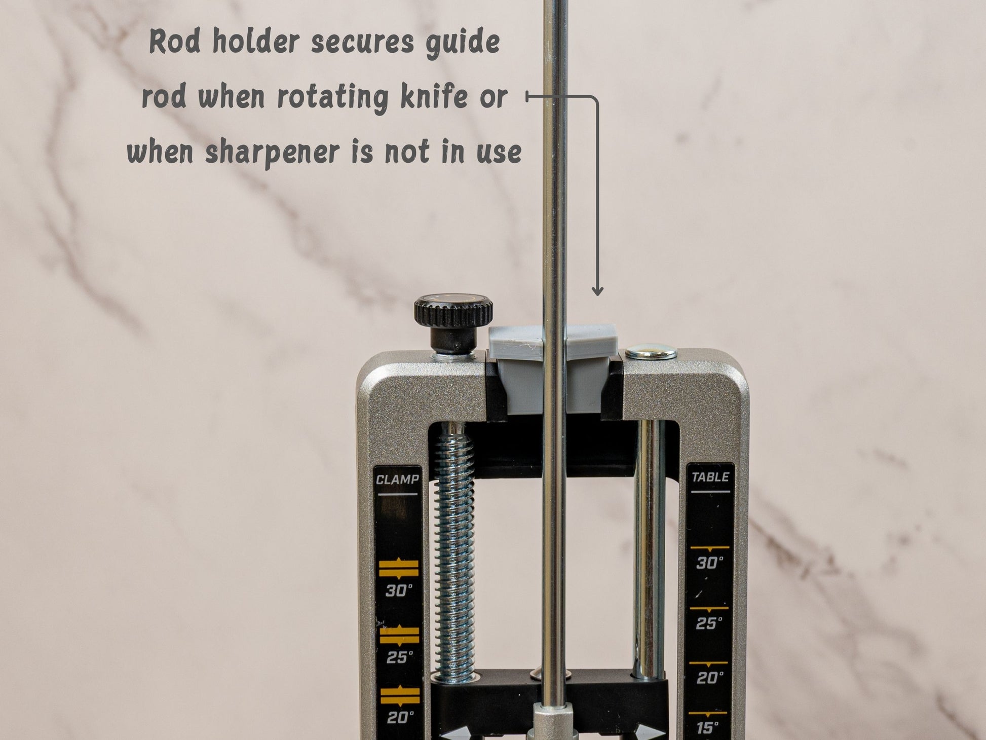 Guide rod holder secures sharpening rod for easier knife rotation and storage.
