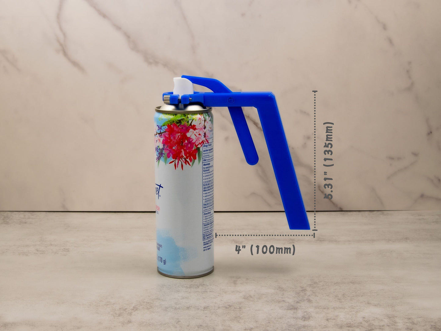 Aerosol can spray assistant measuring 4" long and 5.31" tall, securely mounted on a standard-size can