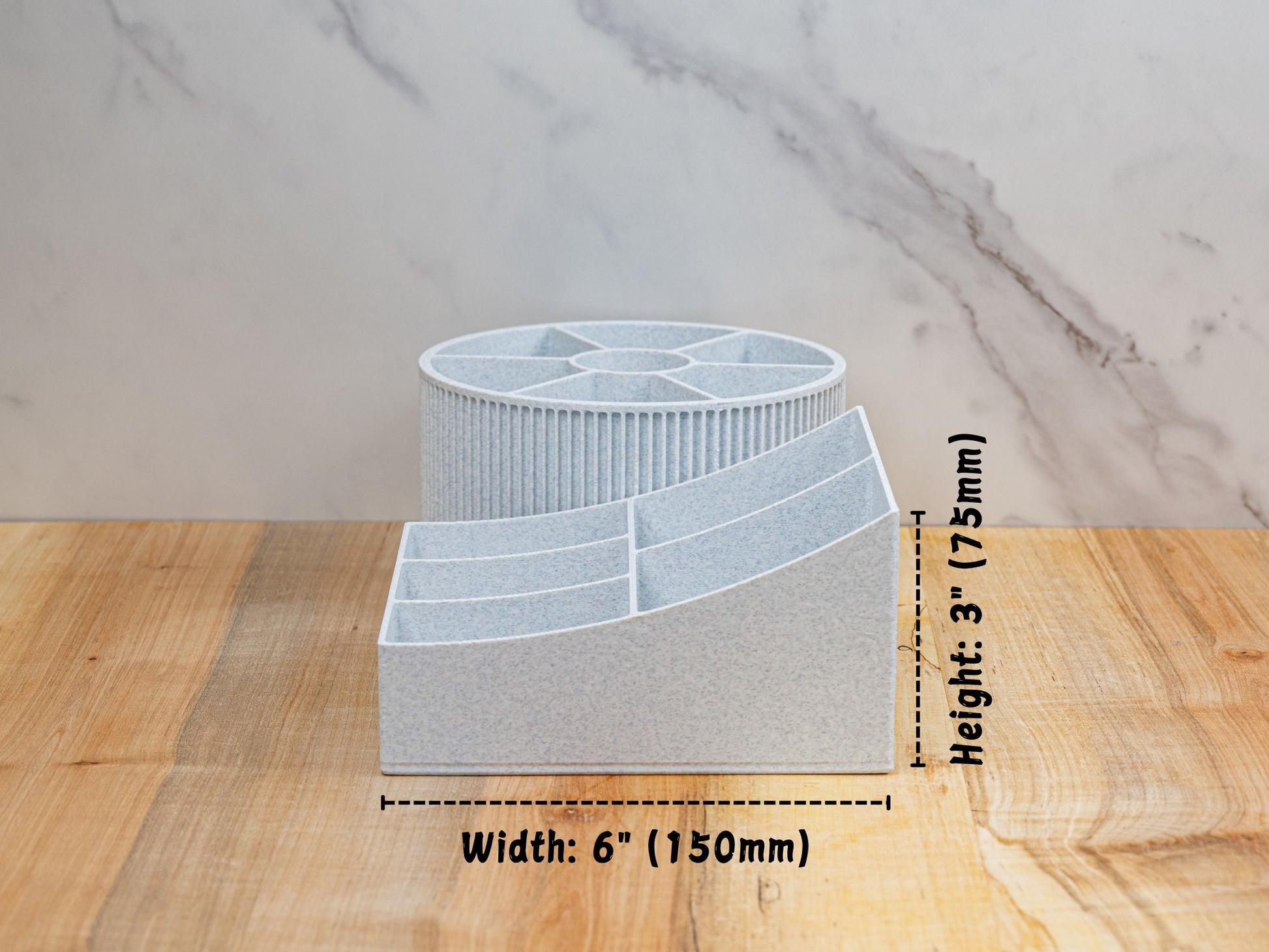 Side measurement graphic showing the rotating beauty organizer’s footprint: width labeled 6 in (150 mm) and overall height 3 in (75 mm), with the round carousel behind the stepped rectangular base for depth reference.