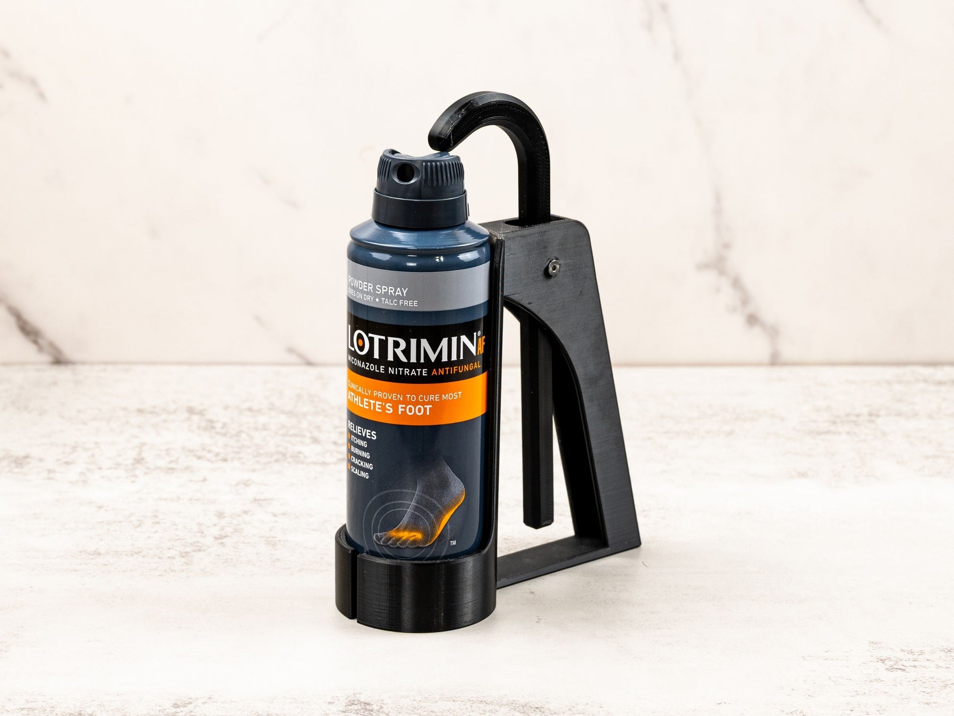 Foot Spray Assistant securely holding a Lotrimin can, shown at a slight angle for a clear view of the device in use.