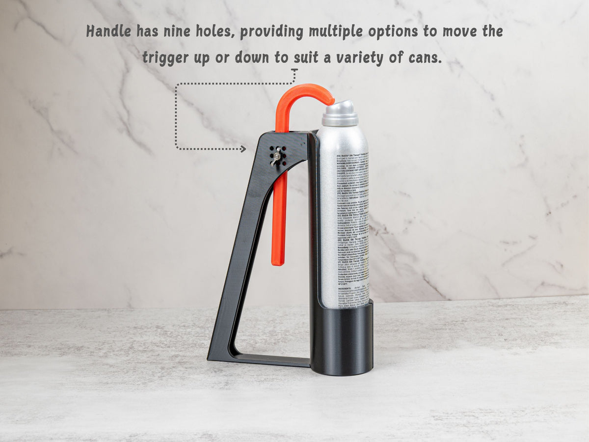 Hairspray Assistant showing nine adjustment holes for positioning the trigger to fit different tall hairspray cans.