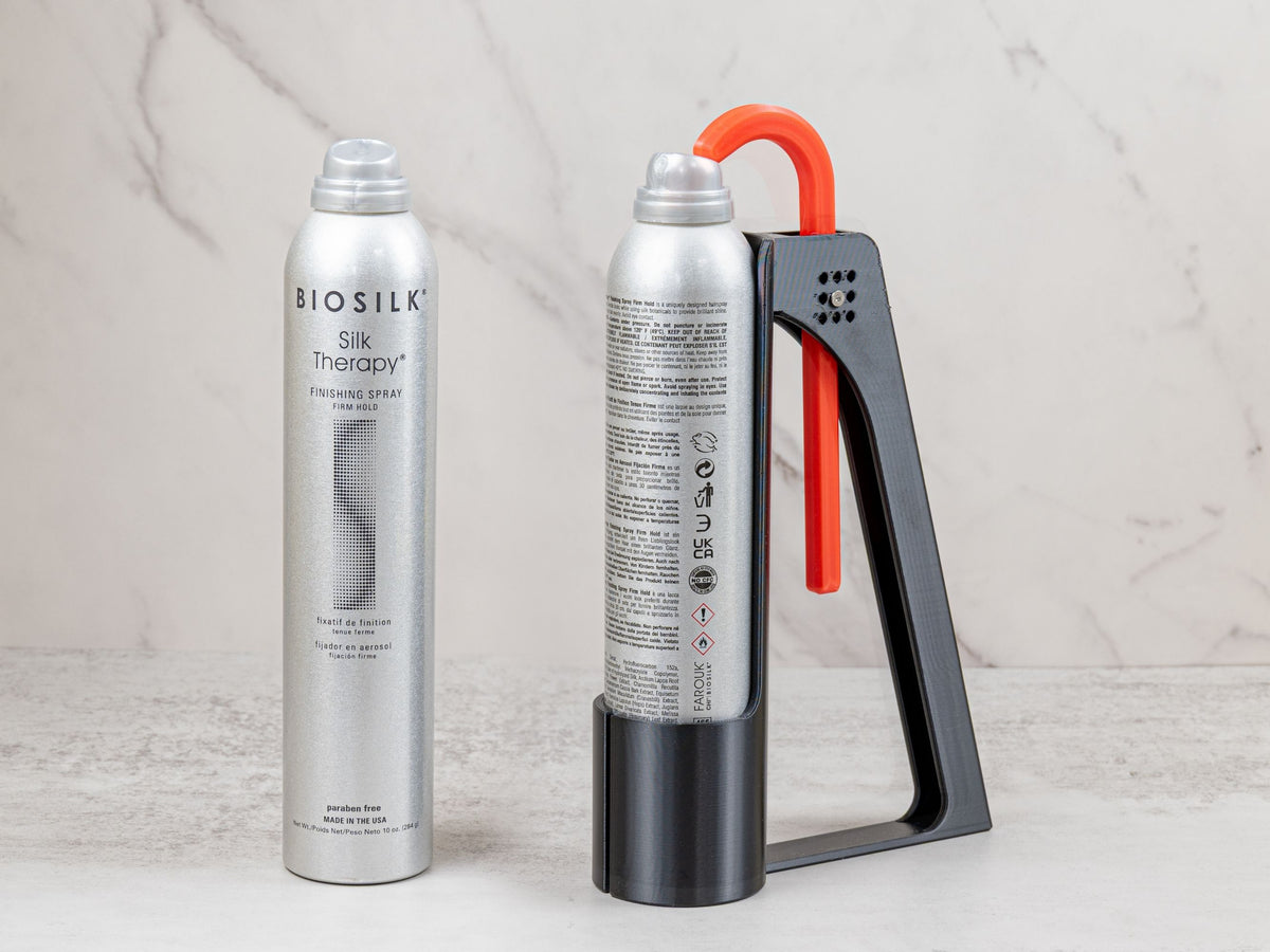 BioSilk hairspray can displayed beside the adaptive Hairspray Assistant designed for tall spray cans.