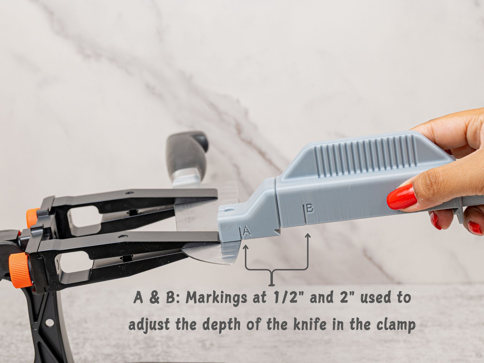 A and B depth markings help position the knife consistently in the Sharpal 202H clamp. Use the 1/2 inch and 2 inch reference points to help repeat your sharpening setup.