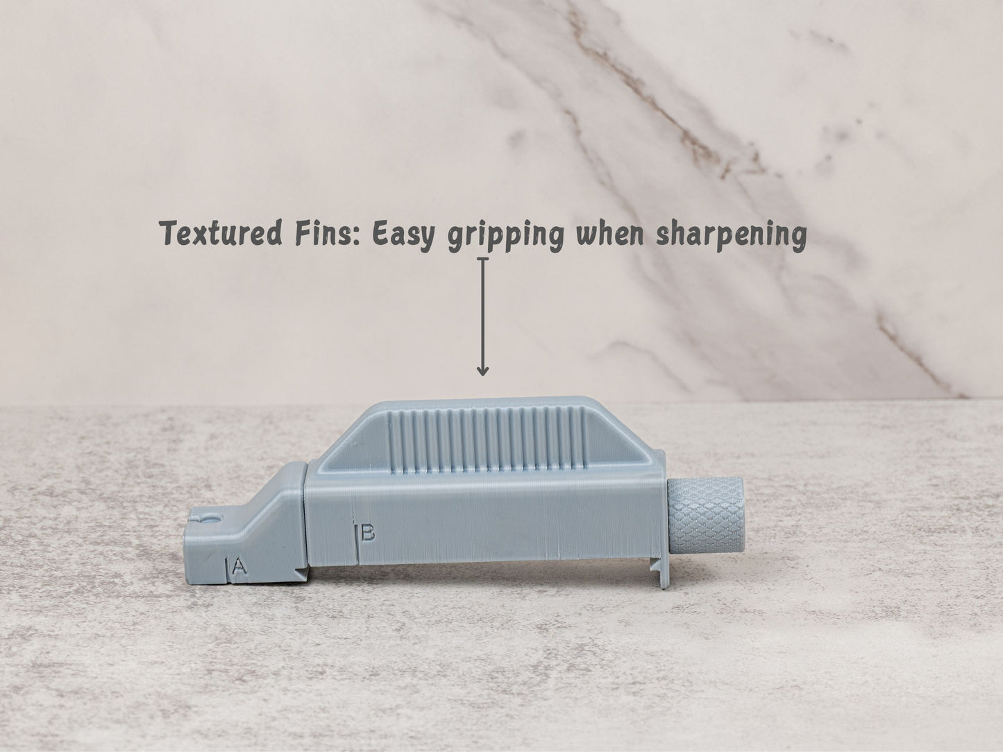 Close up of the textured top fins on the Universal Stone Holder. The raised fins provide a comfortable grip surface while sharpening.
