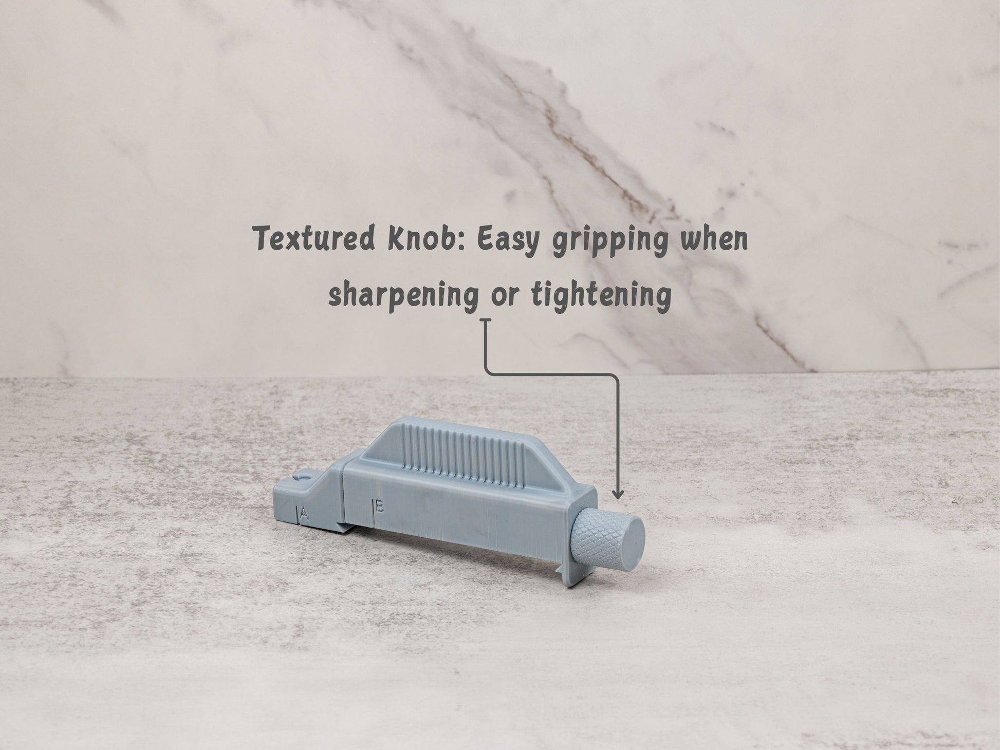 Close up of the textured rear knob. The knurled surface is designed for easy gripping when tightening the holder or guiding the stone during sharpening.