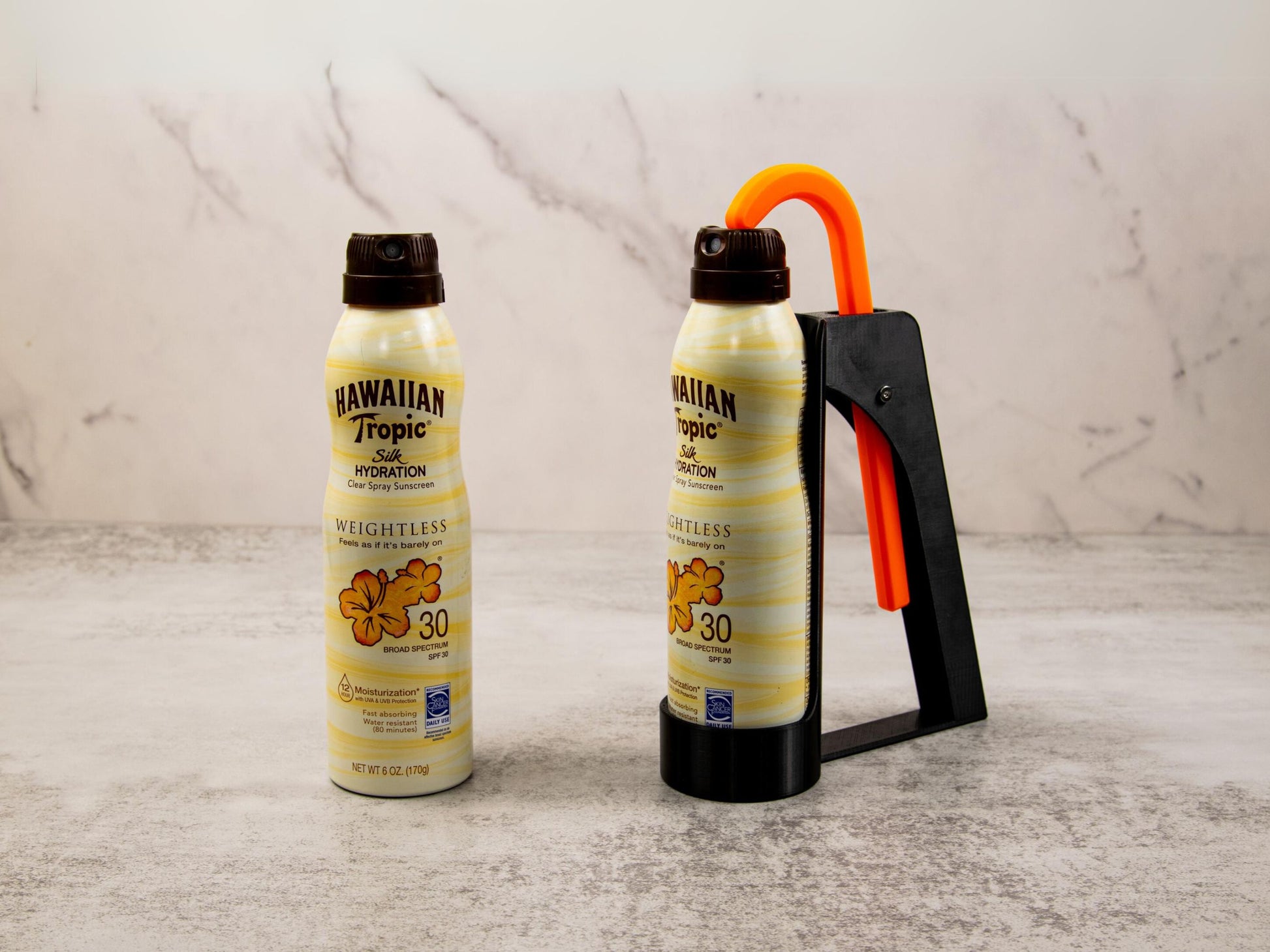 Sunscreen applicator securely holding a Hawaiian Tropic spray can; demonstrates upright position and overall compact size.