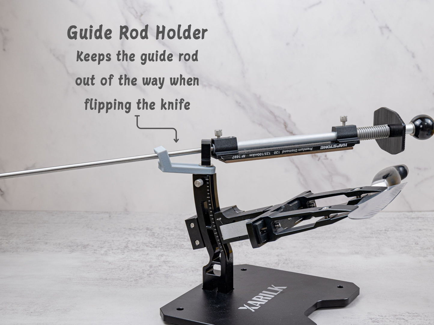 Guide rod holder installed on the Xarilk Gen 3 Knife Sharpener keeping the guide rod elevated and out of the way while flipping the knife during sharpening.