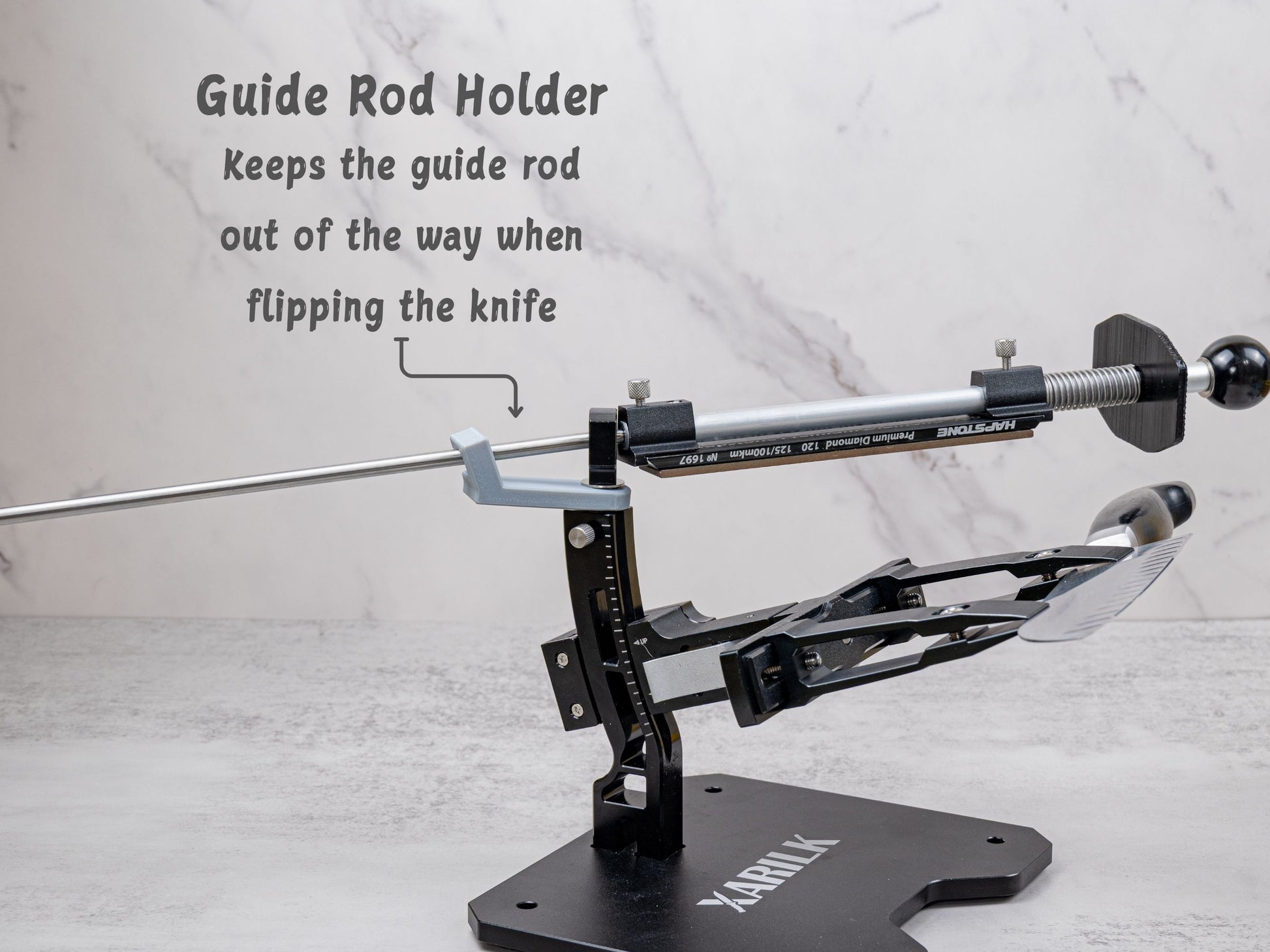 Guide rod holder installed on the Xarilk Gen 3 Knife Sharpener keeping the guide rod elevated and out of the way while flipping the knife during sharpening.