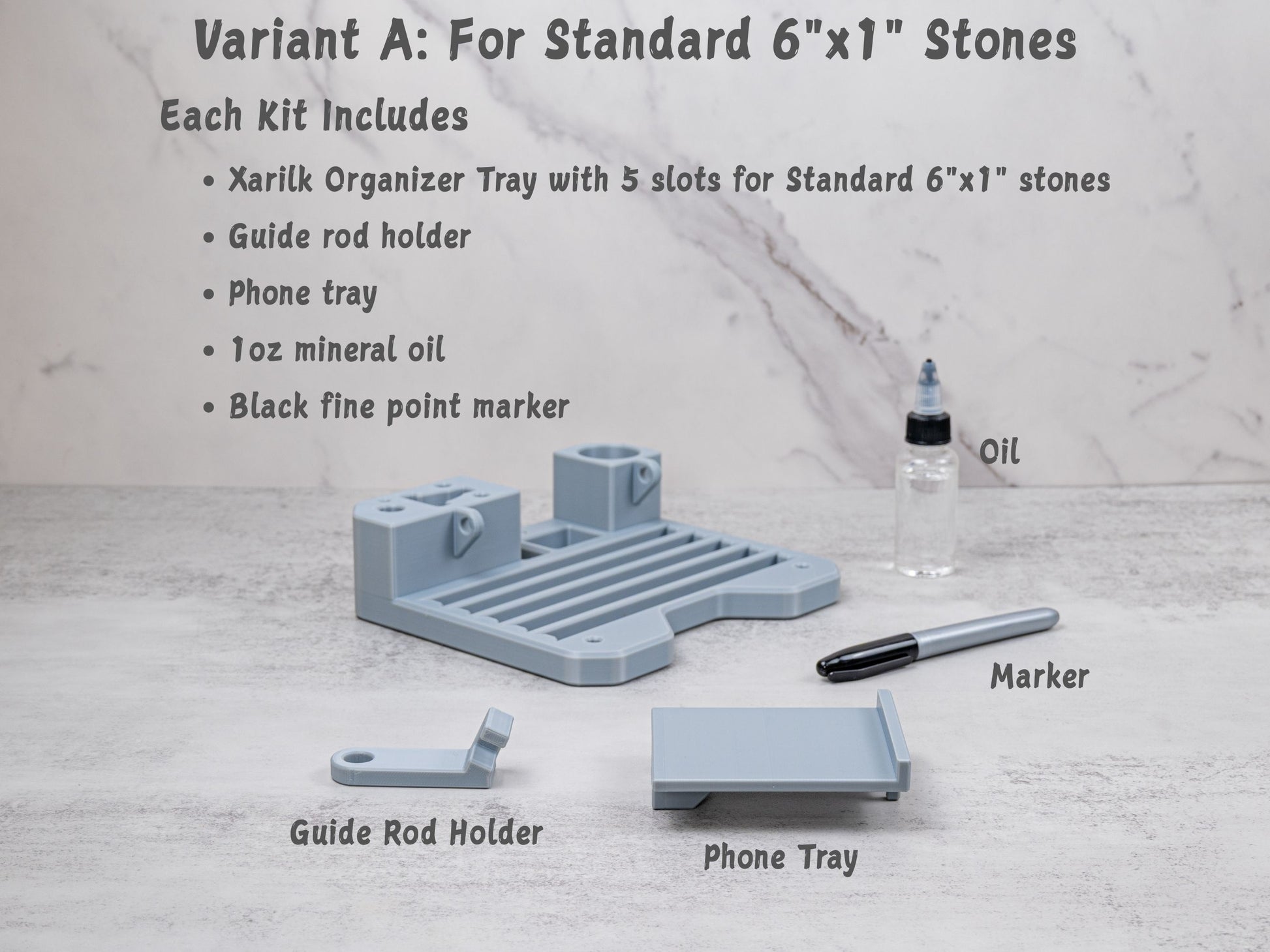 Variant A organizer tray kit for the Xarilk Gen 3 Knife Sharpener laid out on a tabletop, including the tray with five stone slots, guide rod holder, phone tray, one fluid ounce of mineral oil, and a black fine point marker.