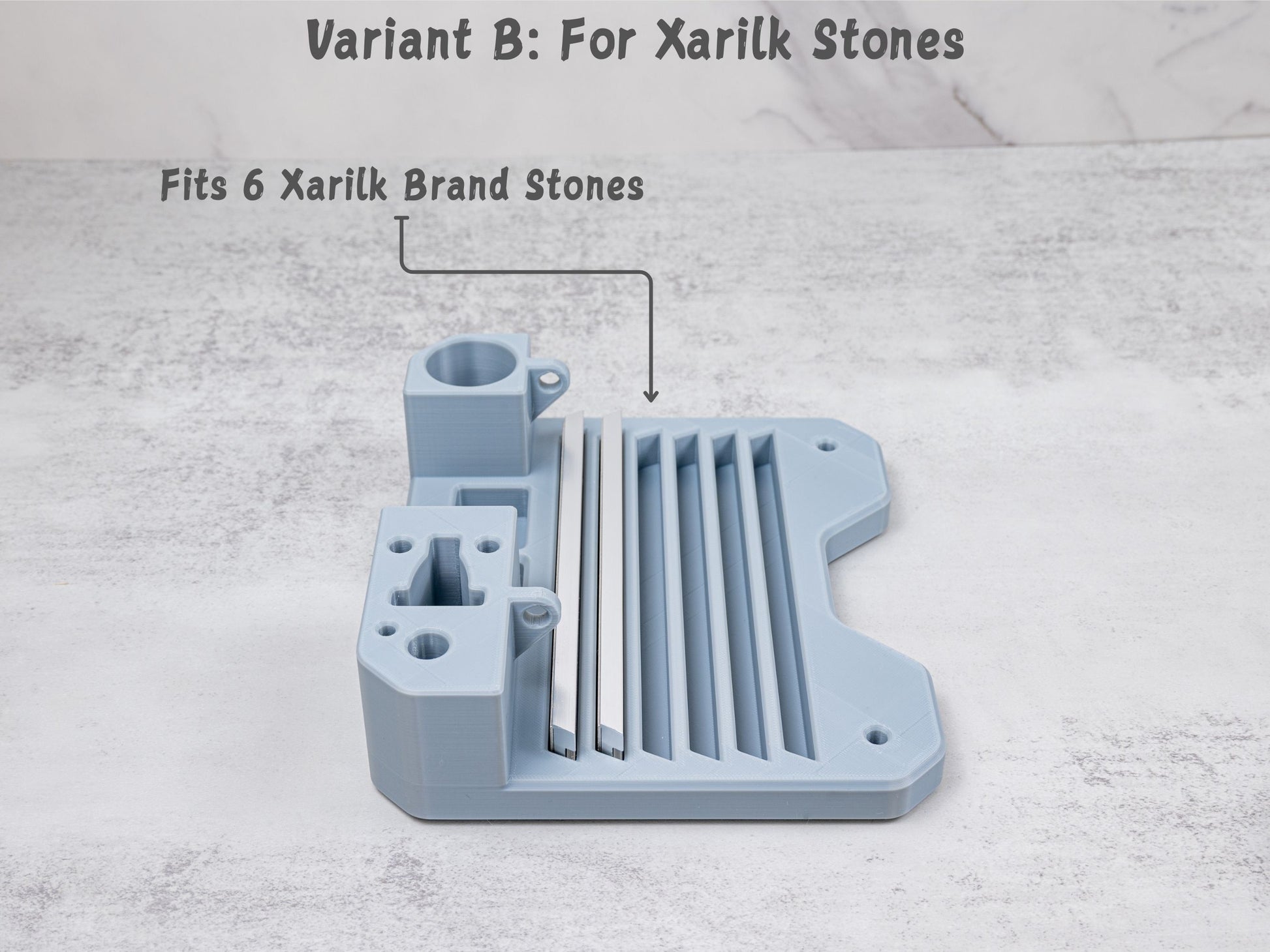 Close up view of the Variant B organizer tray for the Xarilk Gen 3 Knife Sharpener showing six Xarilk branded sharpening stones stored in the stone slots.