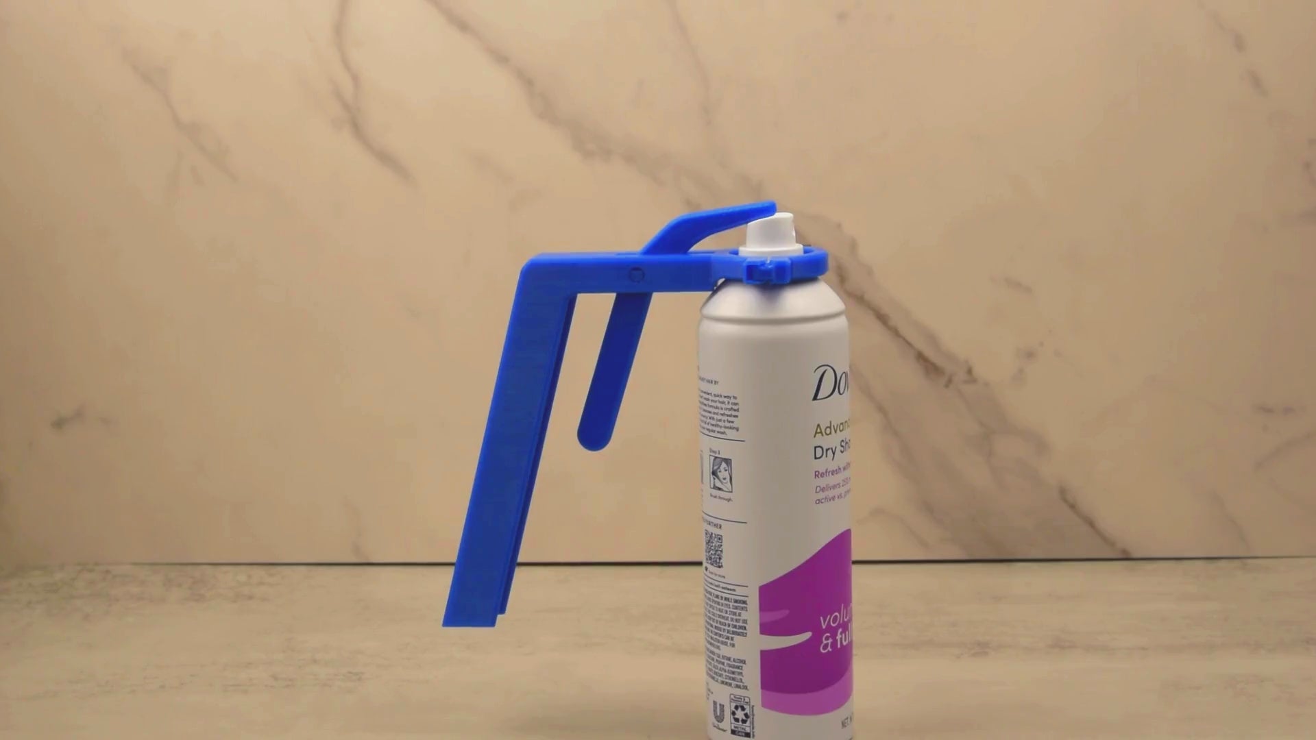 Video demonstrating how to use the Aerosol Can Spray Assistant to easily press down on aerosol can buttons for individuals with limited grip strength or mobility issues.