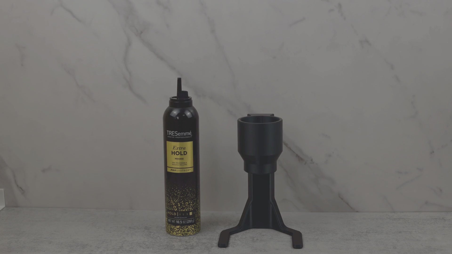 Demonstration of hair mousse dispenser for arthritis and limited mobility