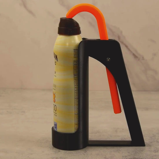 Video showcasing the Sunscreen Spray Assistant making it easier to apply spray sunscreen using one hand, ideal for users with hand strength limitations.